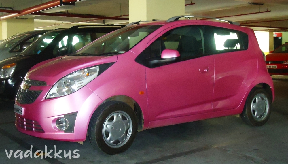 A Bright Pink Chevrolet Beat Car