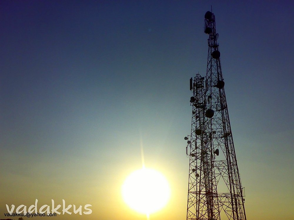 Picture of a beautiful sunset with mobile towers in backdrop at Tumkur.