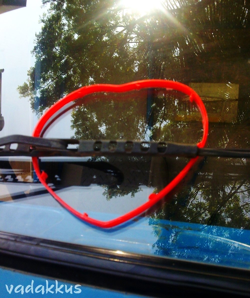 Love shaped plastic band behind a wiperblade