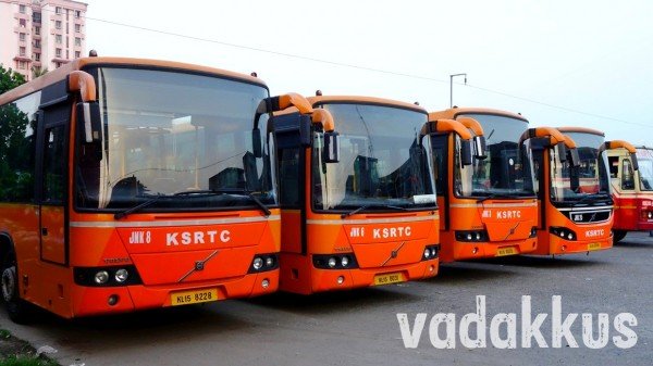 Group of Orange Volvo low floor city buses at Ernakulam