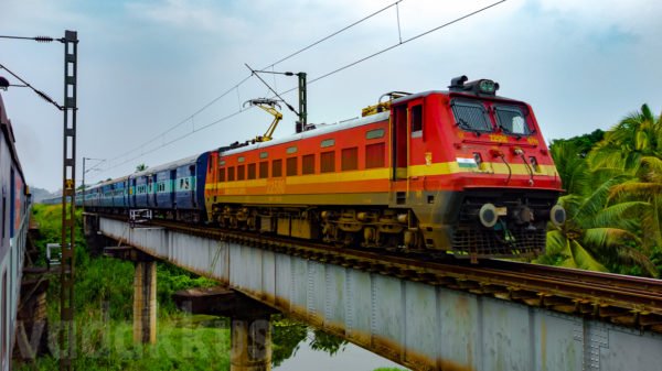 A beautiful picture of a train on a girder bridge in kerala, india. wap4 22580 Sabari Express