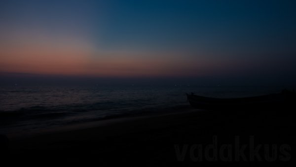 Lonely Beach at Dusk evening after sunset with boat