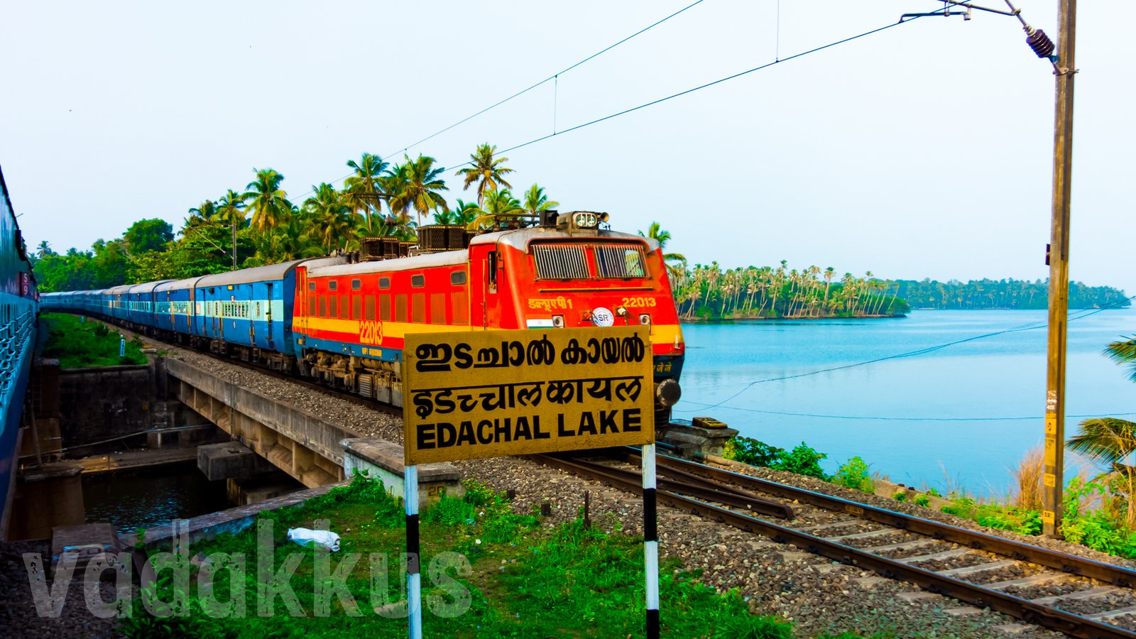 Train with lake in the background greenery natual photo Kerala