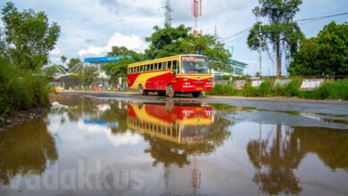 artistic photo ksrtc bus reflected in water vyttila