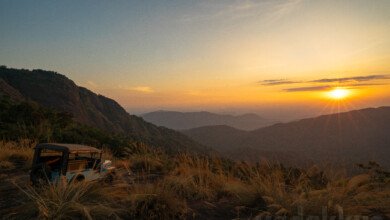 sunset over the hills at mamalakandam in kerala during a jeep safari