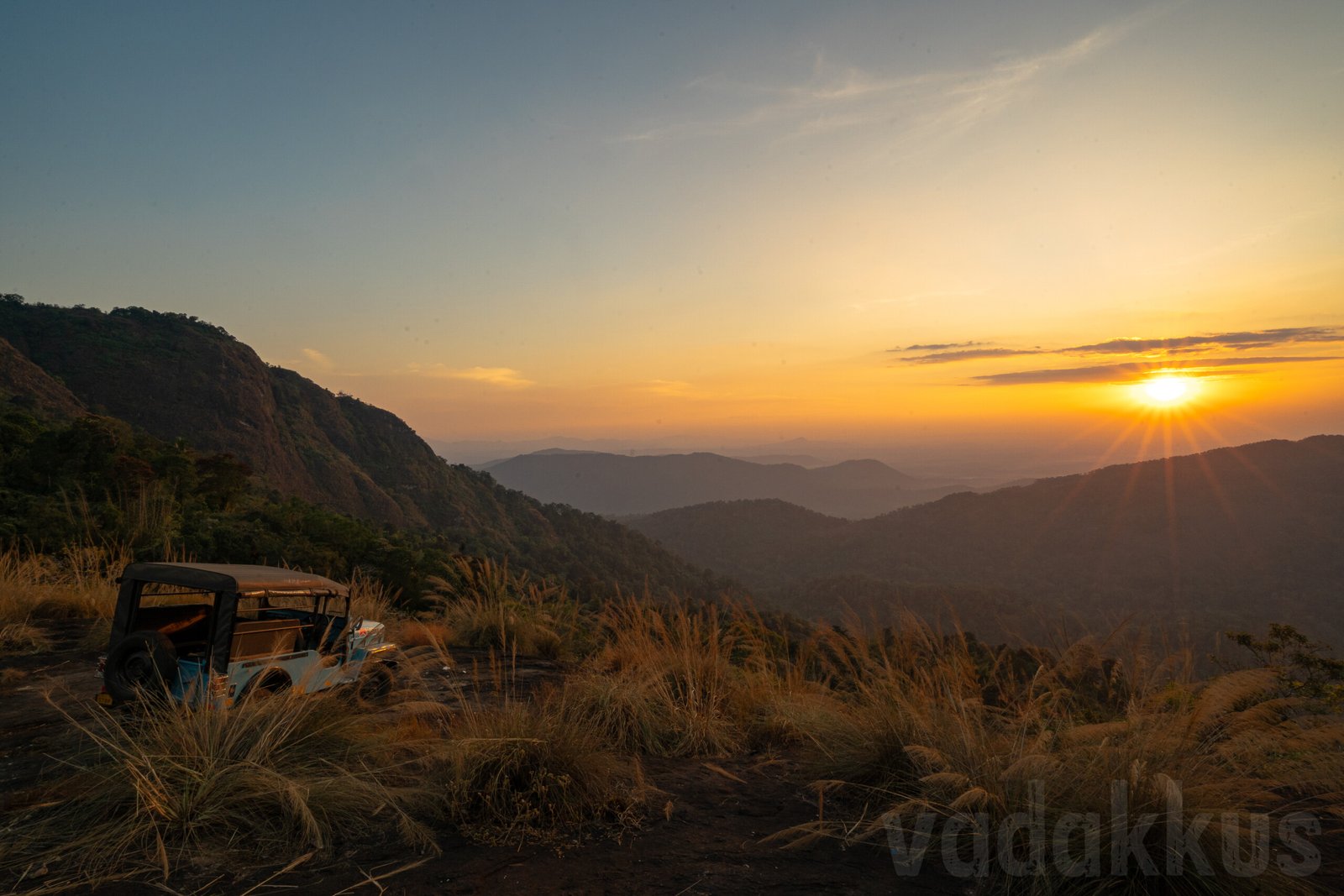 sunset over the hills at mamalakandam in kerala during a jeep safari